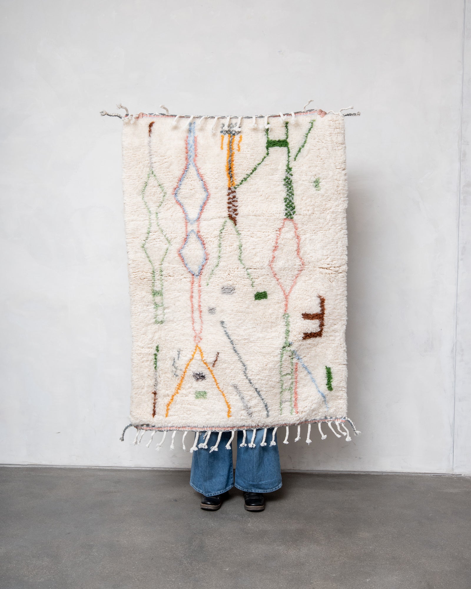 Modern, designer, handcrafted Berber rug from Morocco. Beniourain carpet with beautiful colours and patterns and fluffy wool texture.
